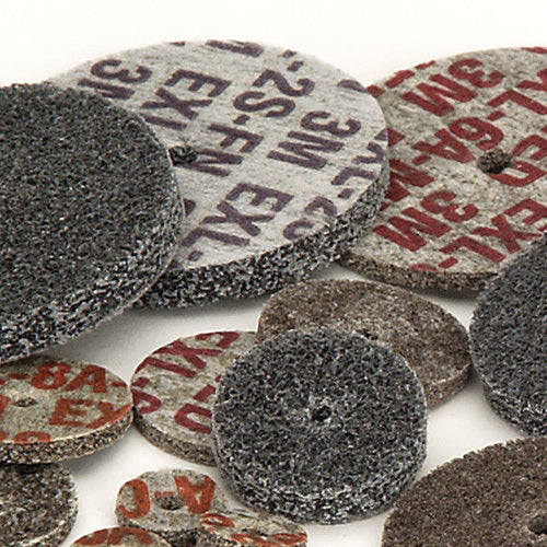A group of 3M™ Scotch-Brite™ EXL Unitized Wheels for deburring, blending, and polishing